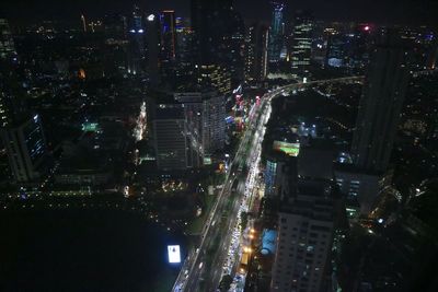 Low angle view of illuminated city at night