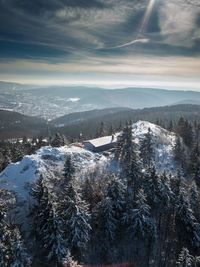 Scenic view of landscape against sky during winter