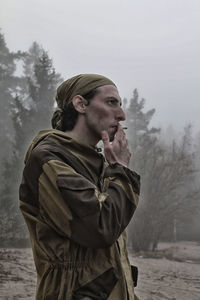 Man looking at camera in winter