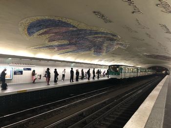 People waiting at railroad station platform