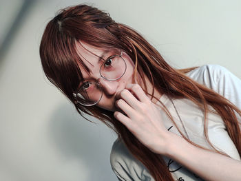 Close-up portrait of woman wearing eyeglasses