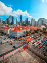 High angle view of city street and buildings against sky