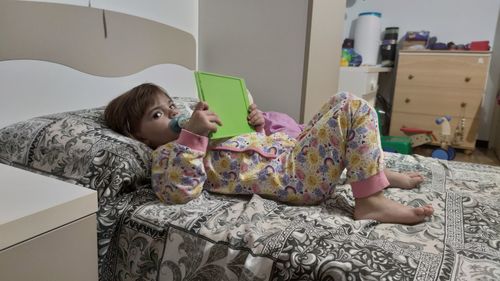 Girl lying on bed at home