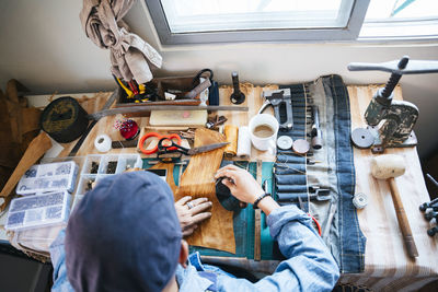 High angle view of man working on table