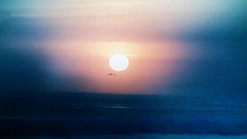 Scenic view of sea against sky at sunset