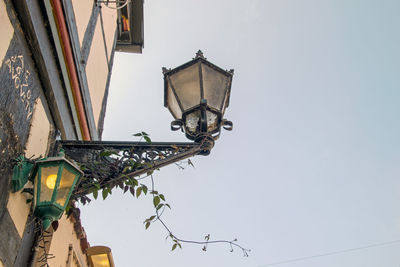 Low angle view of street light against building