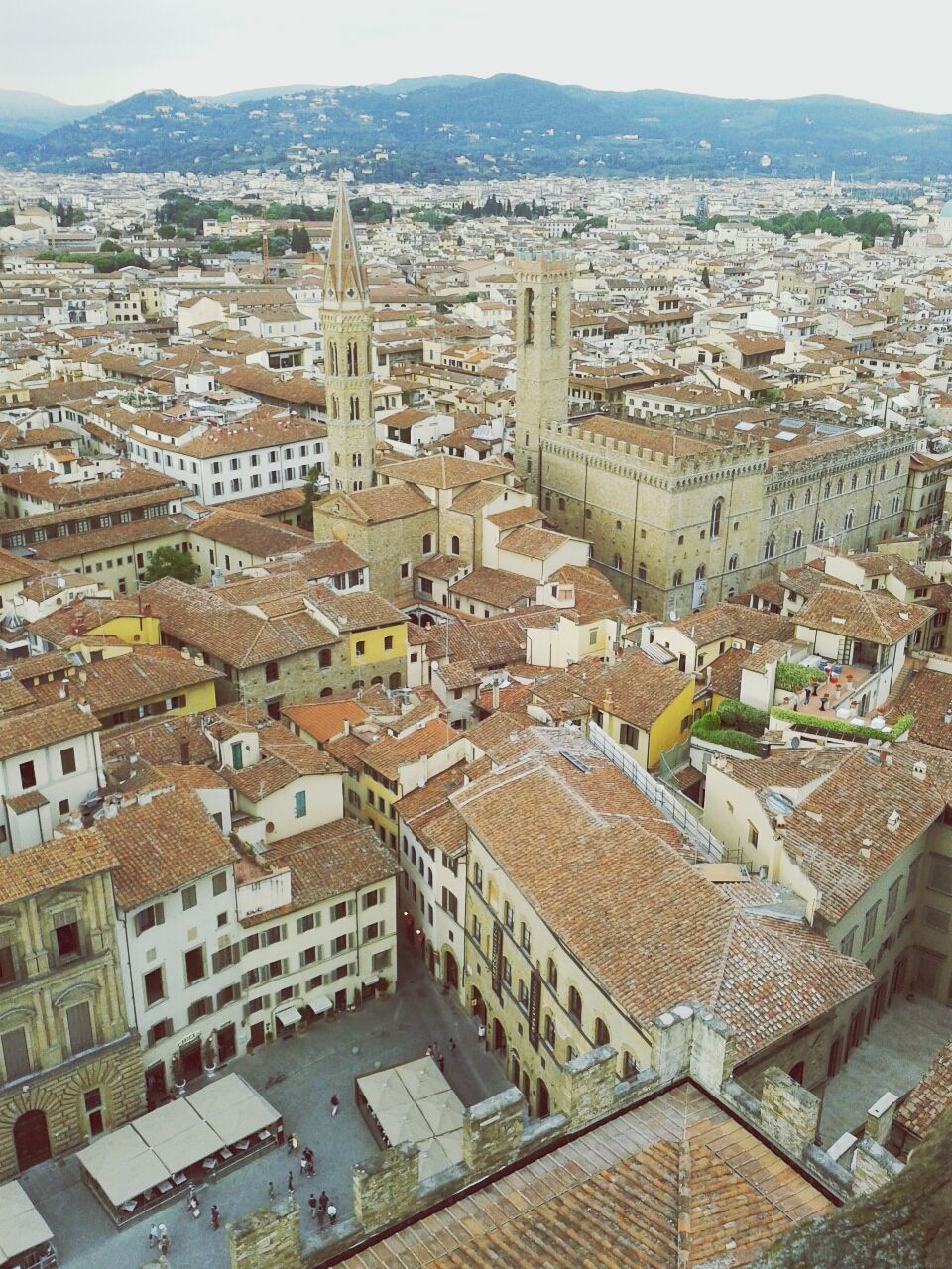 building exterior, architecture, built structure, cityscape, crowded, high angle view, residential district, city, residential building, residential structure, roof, town, townscape, house, aerial view, community, mountain, human settlement, travel destinations, city life