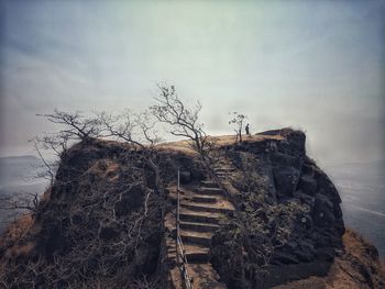 Low angle view of rocks against sky