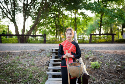 Portrait of young woman in forest