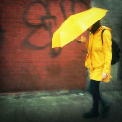 Close-up of man standing on table