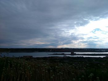 Scenic view of sea against cloudy sky