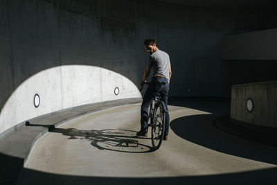 Full length of man skateboarding on wall