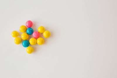 Close-up of colorful balloons against white background