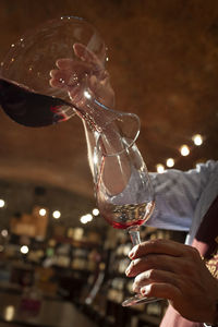 Close-up of hand holding glass of wine