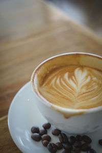 Close-up of cappuccino on table