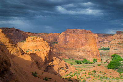 View of rock formations against cloudy sky