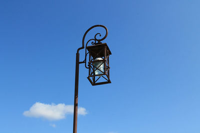 Low angle view of basketball hoop against blue sky