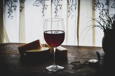 Close-up of wine in glass on table