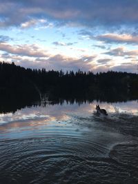 Scenic view of lake against sky during sunset