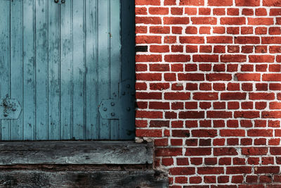 Closed door of brick wall