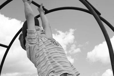 Low angle view of child against sky