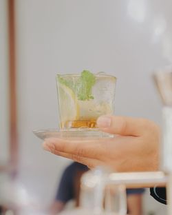 Close-up of hand holding wine glass