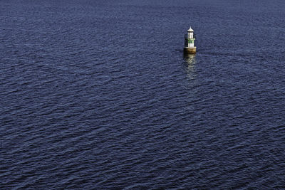 High angle view of lighthouse by sea