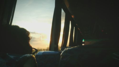 Rear view of man sitting in bus