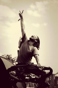 Low angle view of building against cloudy sky