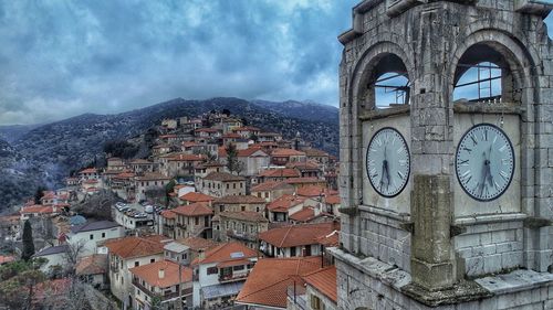 Old buildings in town against sky
