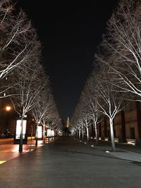 Illuminated city against sky at night