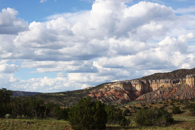 View of rocky landscape against cloudy sky