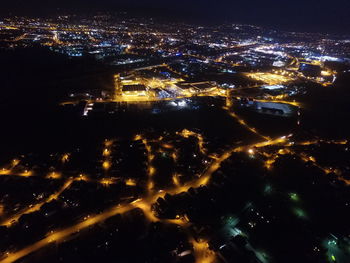 Aerial view of illuminated city at night