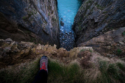 Low section of man on cliff