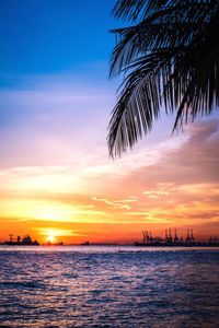 Scenic view of sea against sky at sunset