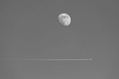 Low angle view of moon against sky at night