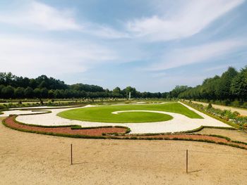 High angle view of golf course against sky