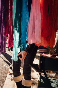 Midsection of woman standing in market