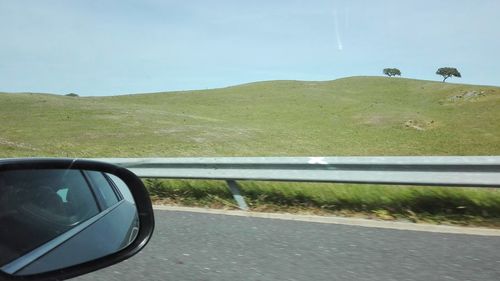 Car on road against clear sky