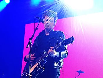 Full length of man playing guitar