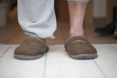 Low section of man standing on floor