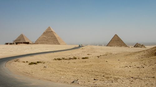 Sand dune in desert against clear sky