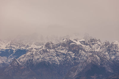 Scenic view of snowcapped mountains against sky during winter