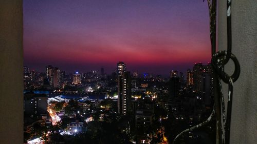 Illuminated buildings in city at night