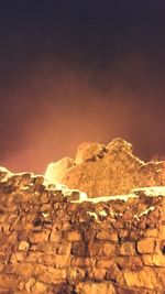 Rocks in desert against sky