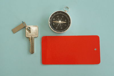 Directly above shot of clock on blue background
