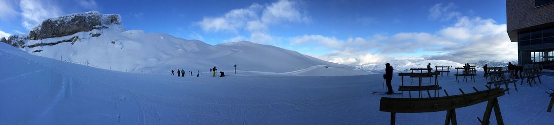 Panoramic view of snowcapped mountains against sky