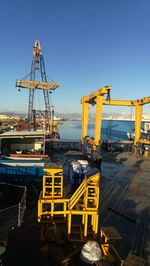 Commercial dock against clear blue sky