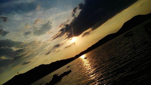 Scenic view of sea against sky at sunset