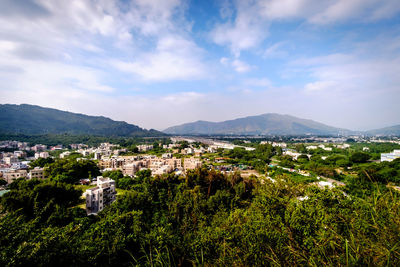 High angle view of city against cloudy sky